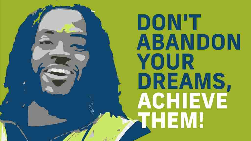 Smiling man in a high-visibility vest stands beside bold text, "Don't Abandon Your Dreams, Achieve Them!" on a vibrant green background.