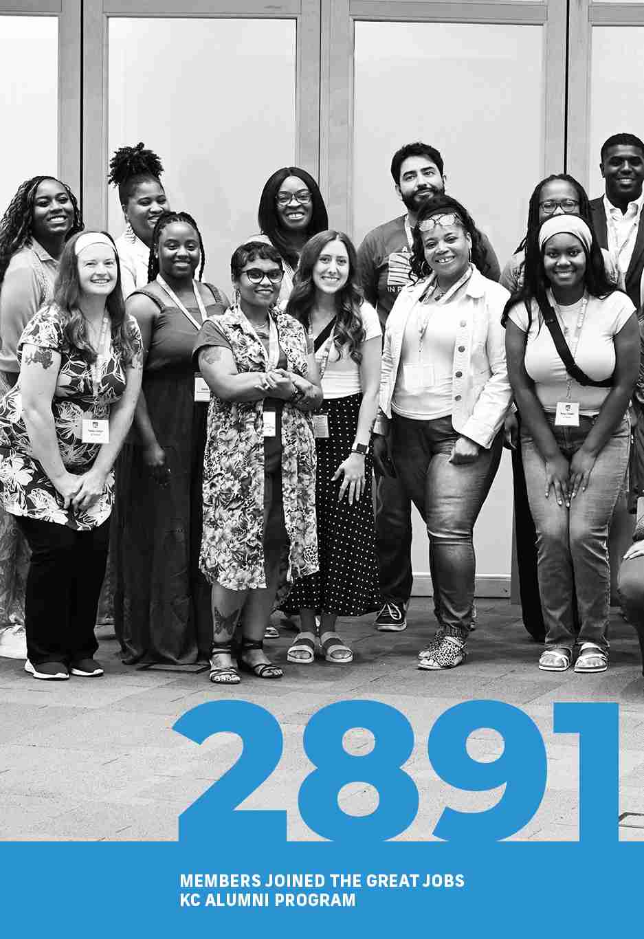 A diverse group of 15 adults stands together posing for a group photo. Text at the bottom reads "2891 members joined the Great Jobs KC Alumni Program," highlighted in this year's annual report.
