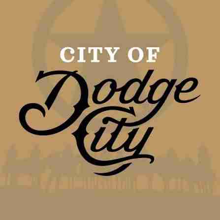City of Dodge City logo with stylized text on a tan background, featuring a faint star and silhouettes of buildings at the bottom. Includes Patterson Family Foundation Grant Updates for added community support.
